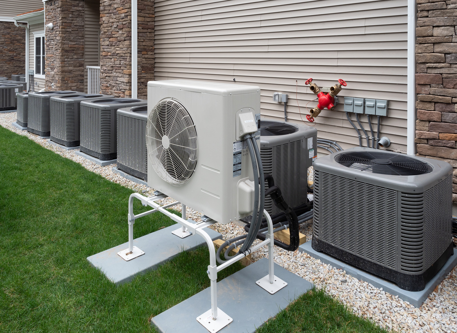 The image shows an installed heat pump or air conditioner.