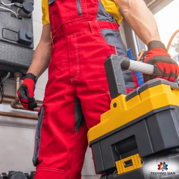 HVAC technician carrying a toolbox